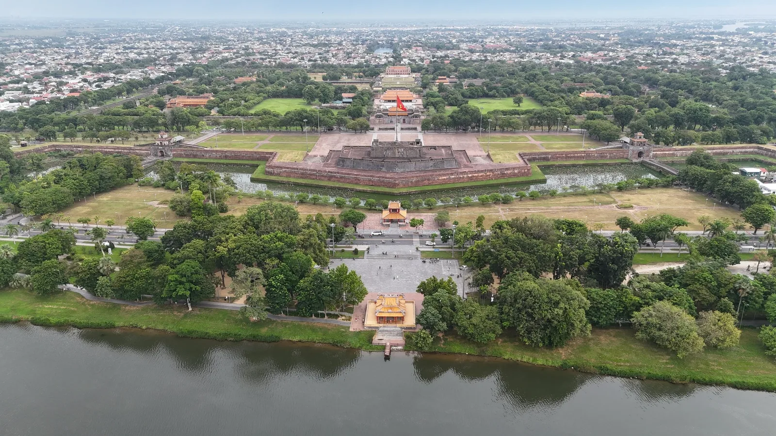 Aerial view of the Hue Imperial Citadel with its walls, flag tower, and river in Hue, Vietnam