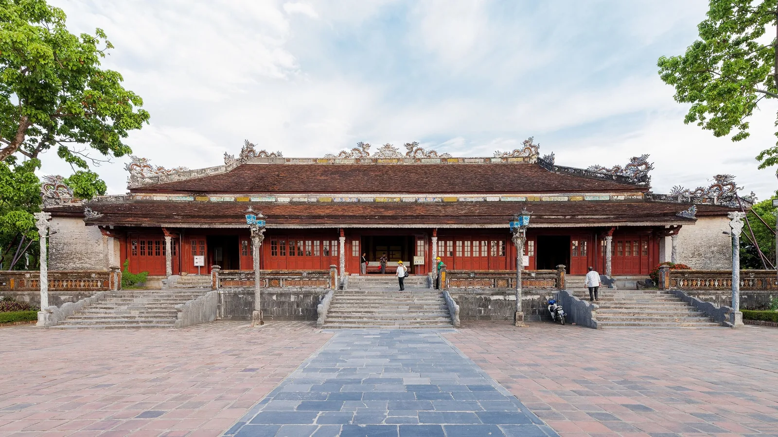 Thai Hoa Palace's ornate red-and-gold facade stands beneath a tiled roof within Hue's Imperial City.