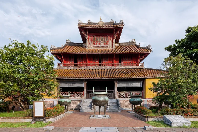 The Hien Lam pavilion with bronze dynastic urns stands within the Hue Imperial Citadel in Vietnam.